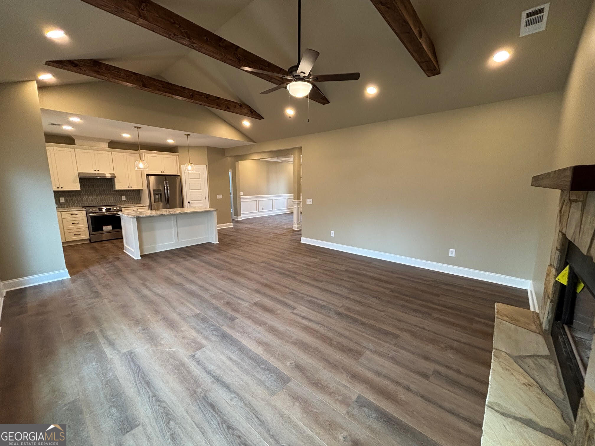 178 Samson Way Cleveland, GA 30528 - Photo 9 of 32 a view of a big room with wooden floor and a kitchen