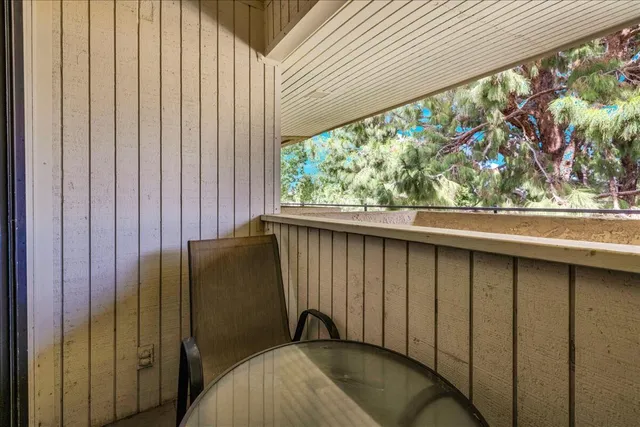 a view of a house with swimming pool and sitting area