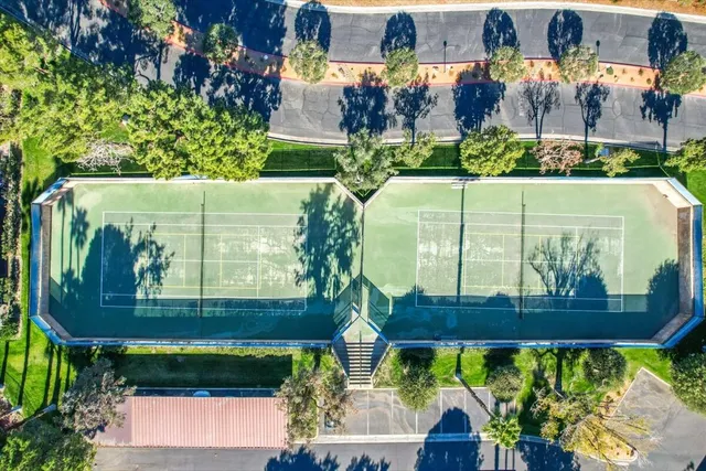 a view of a swimming pool with an outdoor seating