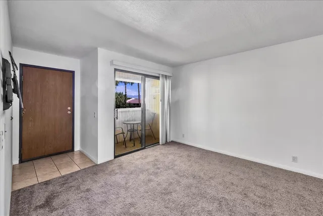 a view of a kitchen with a sink and cabinet area