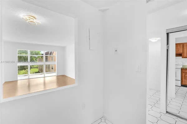 a view of an empty room with a window
