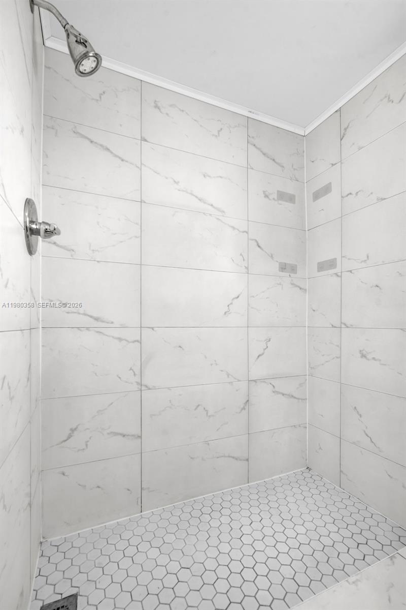 2720 North Pine Island Road, Unit 306 Sunrise, FL 33322 - Photo 7 of 23 a bathroom with a shower