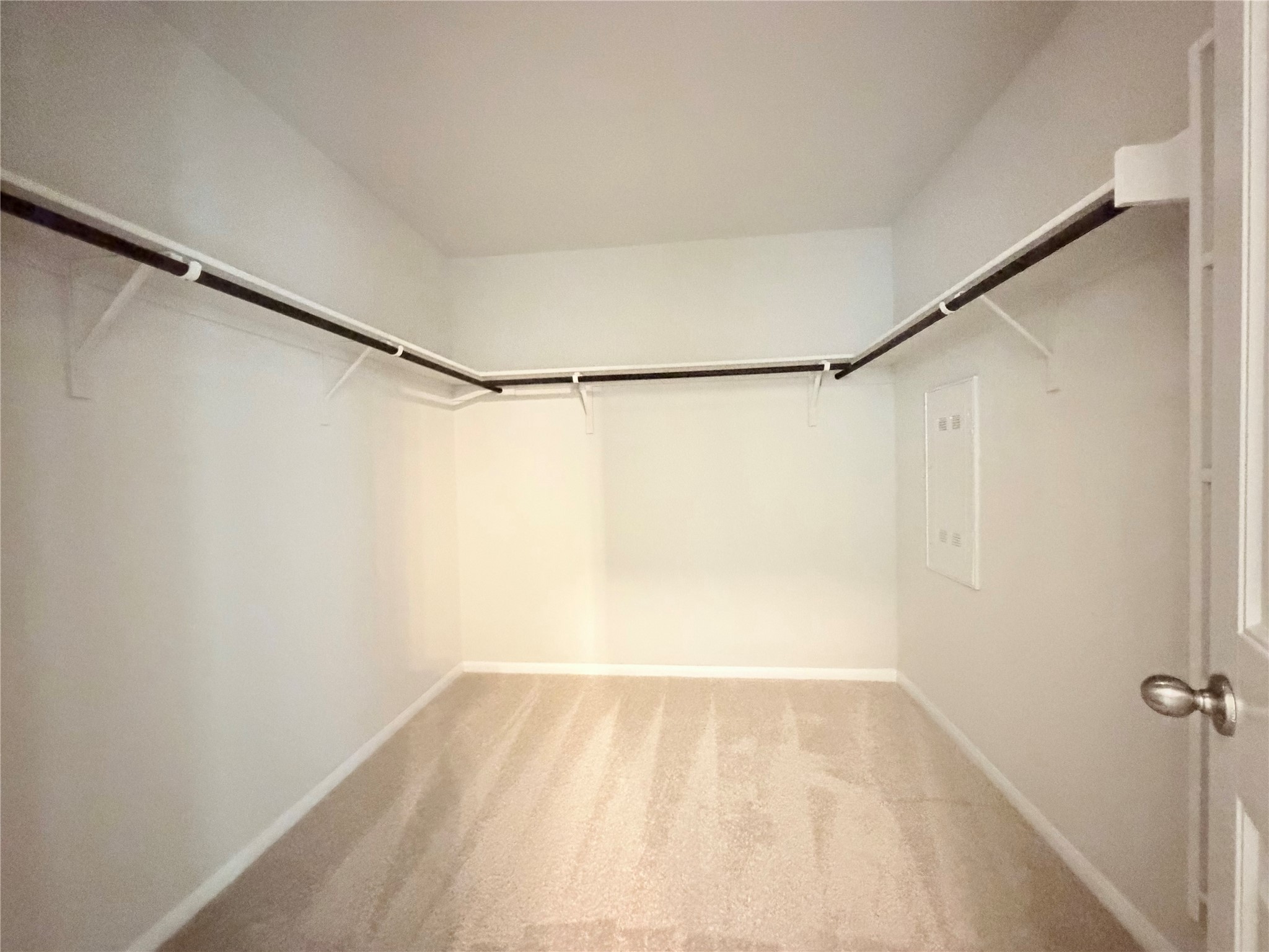 10502 Fulton Avenue Austin, TX 78754 - Photo 22 of 36 Ample hanging space and soft carpeting define this practical closet for organized living.