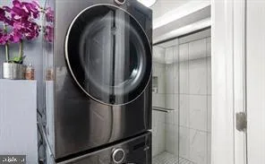 a close view of water heater room with washer and dryer