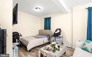 a bedroom with bed and window