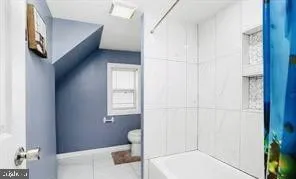 a bathroom with a toilet sink and tub