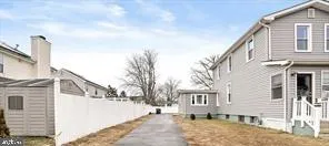 a view of a house with a snow on the road