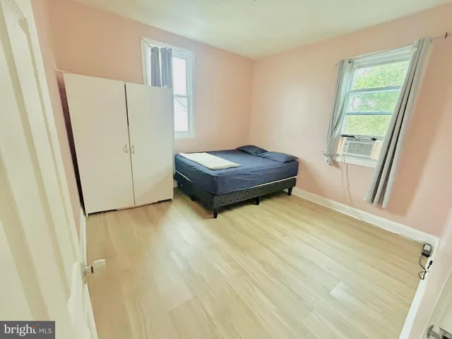 a room with a wooden floor and door