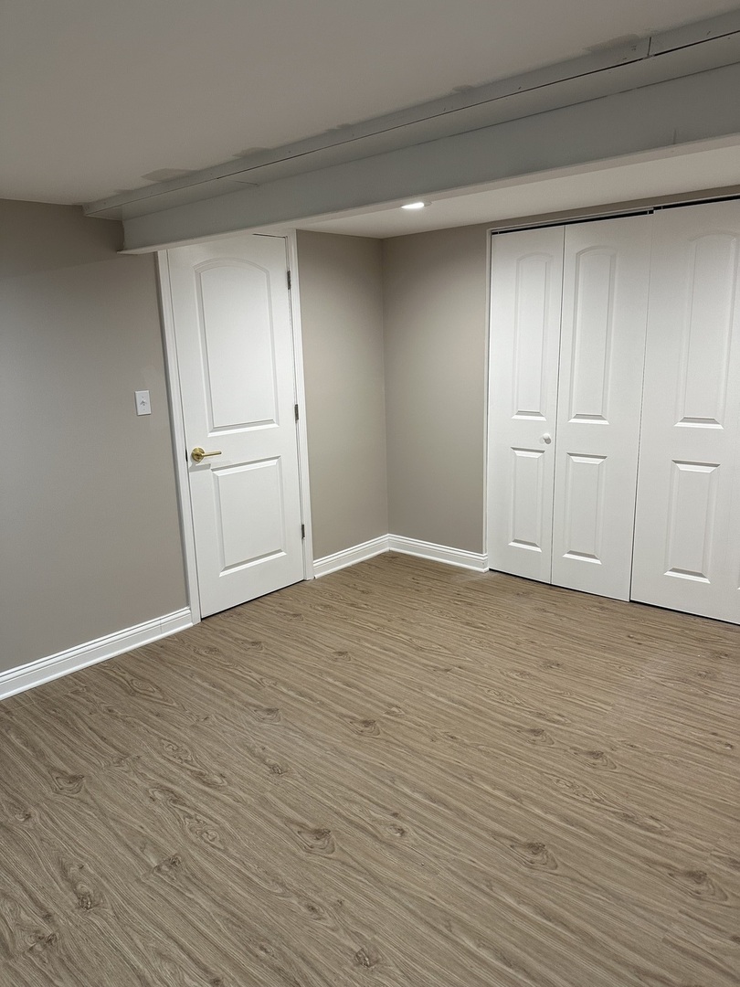 11754 South Laflin Street Chicago, IL 60643 - Photo 16 of 18 a view of an empty room and wooden floor