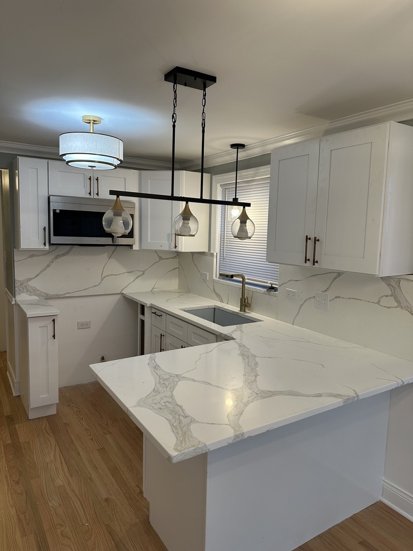 11754 South Laflin Street Chicago, IL 60643 - Photo 5 of 18 a kitchen with stainless steel appliances a sink and a stove