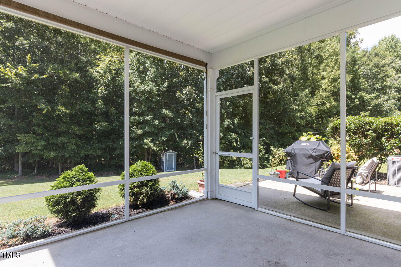 3464 Althorp Drive Raleigh, NC 27616 - Photo 25 of 32 Perfect time of year to enjoy this wonderful view on the screened porch!