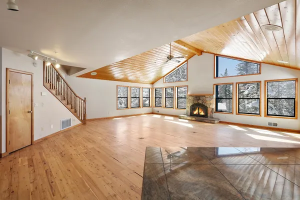 a view of an entryway with wooden floor