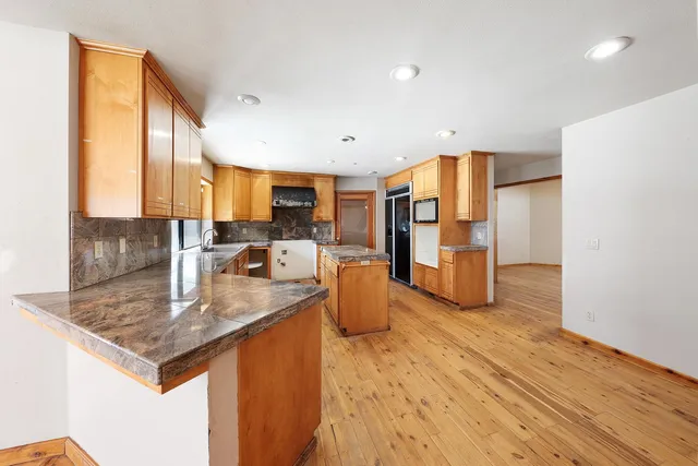 a bathroom with a window and a shower