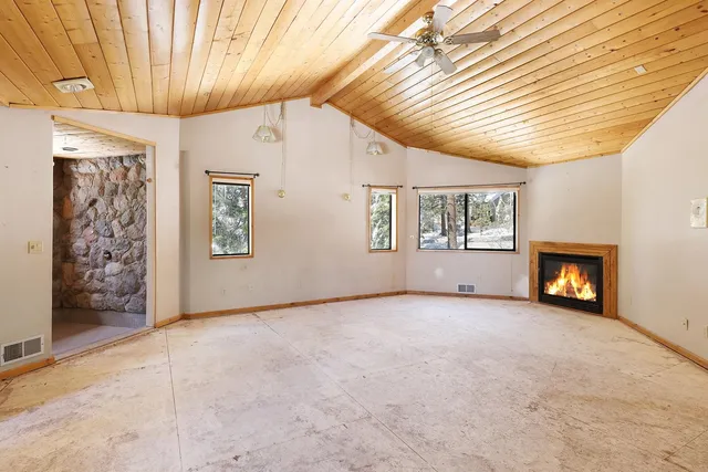 a view of room with window and wooden floor