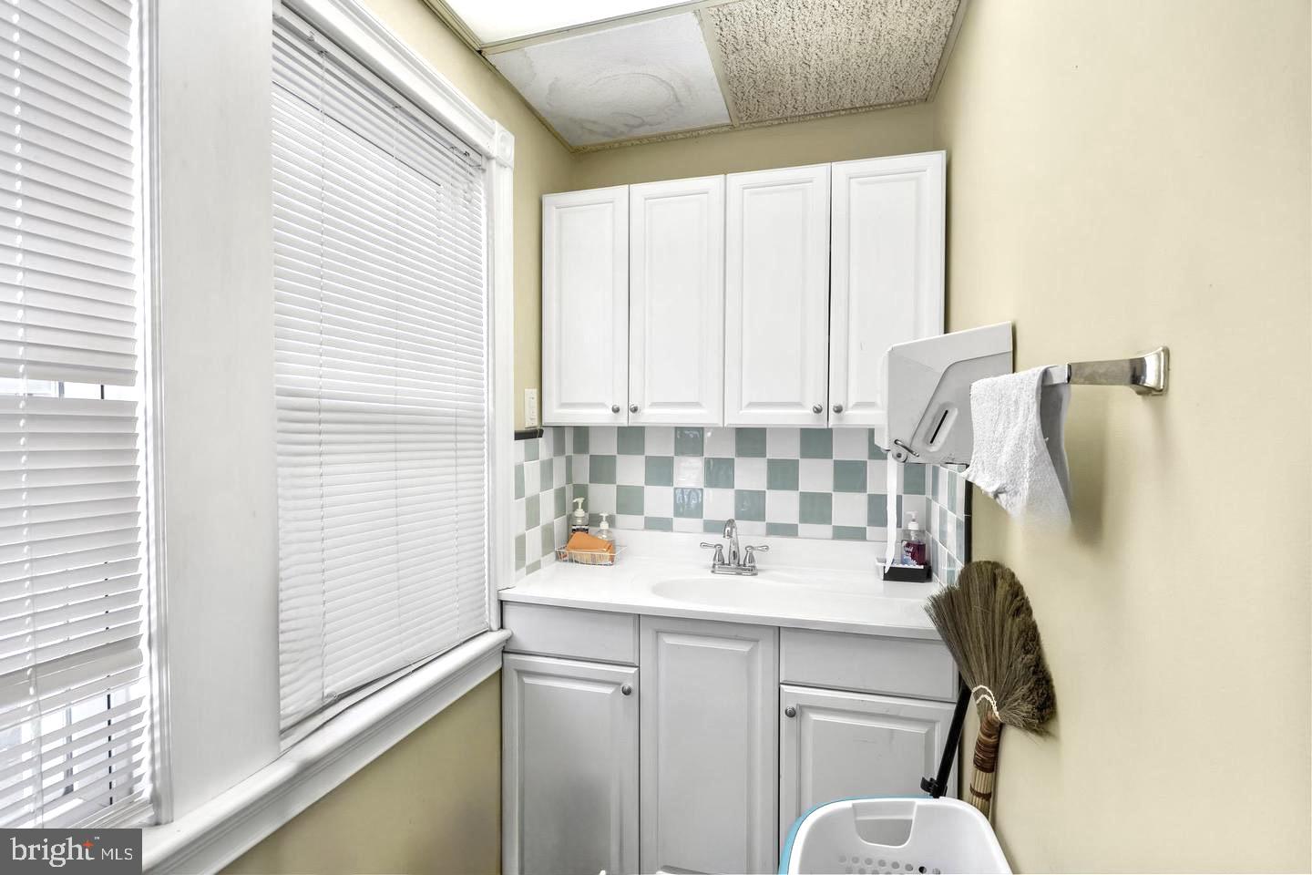 117 South Pavilion Avenue Riverside, NJ 08075 - Photo 32 of 38 a bathroom with a sink and a mirror