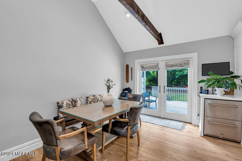 921 Lovett Road Colts Neck, NJ 07722 - Photo 16 of 55 a view of a dining room with furniture window and wooden floor