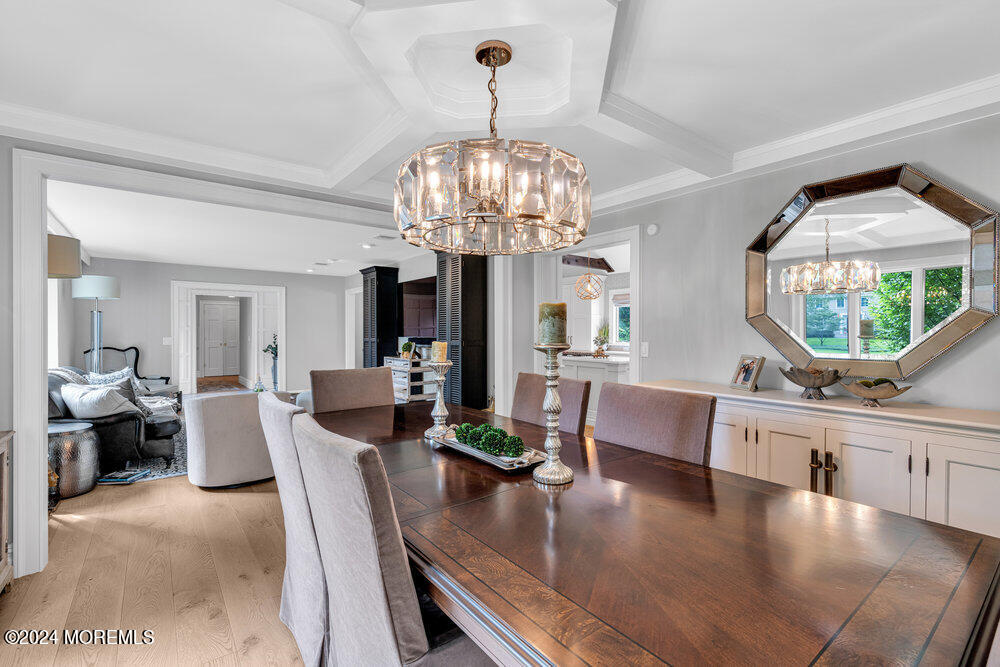 921 Lovett Road Colts Neck, NJ 07722 - Photo 18 of 55 a living room with fireplace furniture and a chandelier