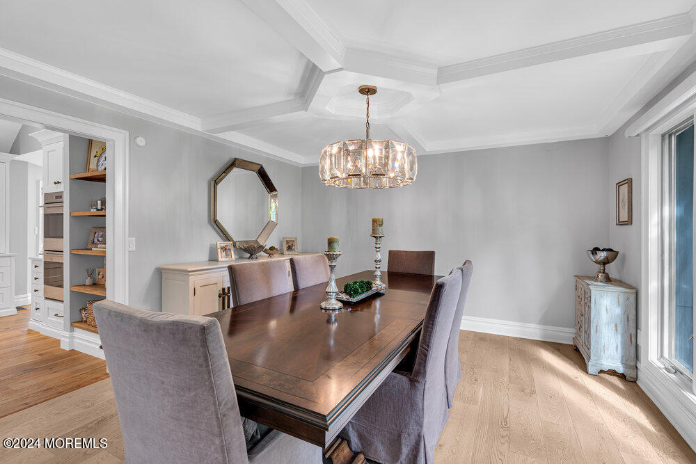 921 Lovett Road Colts Neck, NJ 07722 - Photo 20 of 55 a view of a dining room with furniture and chandelier