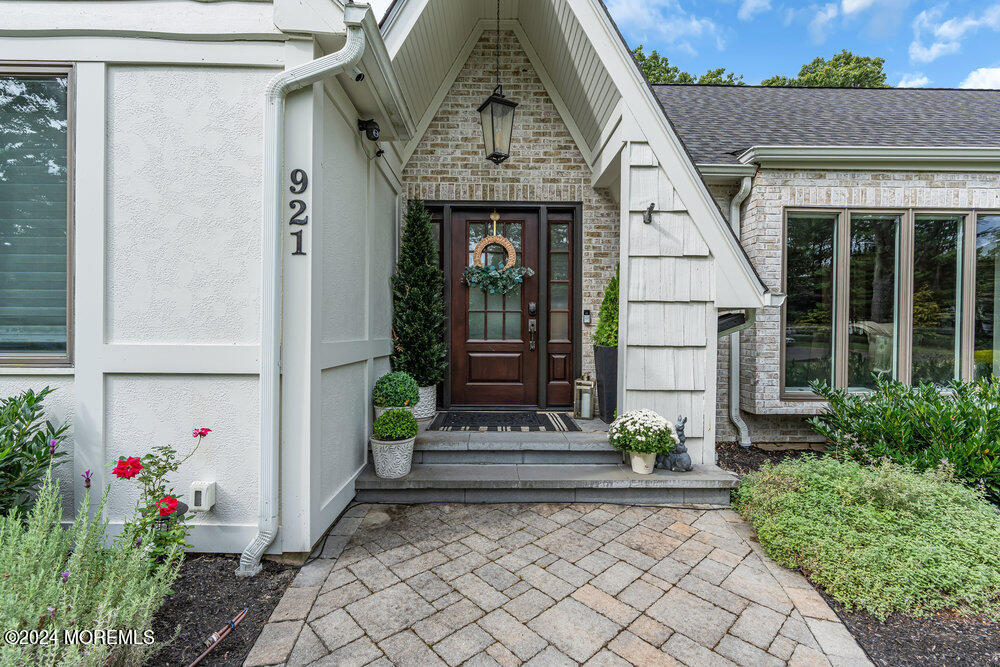 921 Lovett Road Colts Neck, NJ 07722 - Photo 2 of 55 a front view of a house with entryway