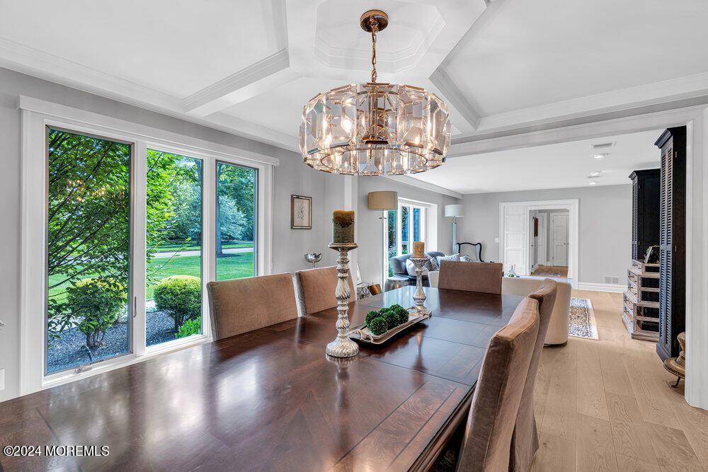 921 Lovett Road Colts Neck, NJ 07722 - Photo 21 of 55 a living room with furniture and a chandelier