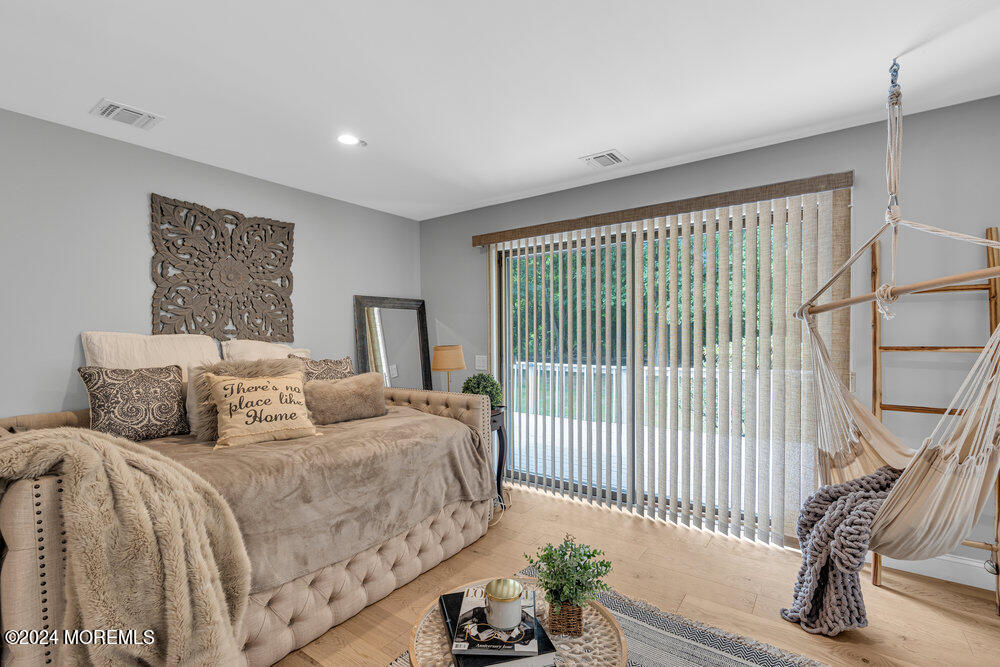 921 Lovett Road Colts Neck, NJ 07722 - Photo 23 of 55 a bedroom with a bed and a window