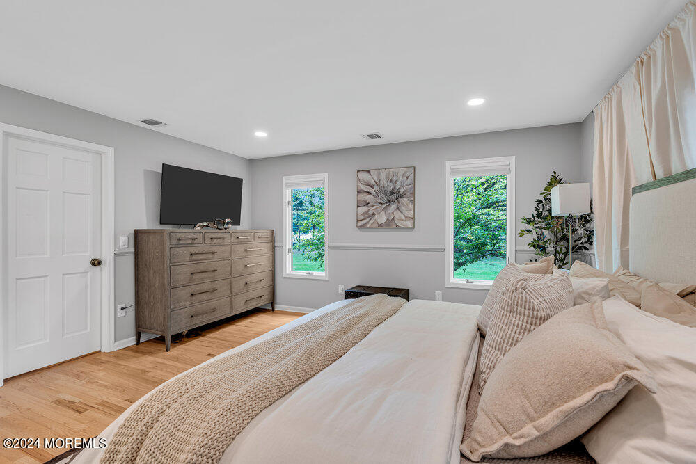 921 Lovett Road Colts Neck, NJ 07722 - Photo 25 of 55 a bedroom with a bed and furniture