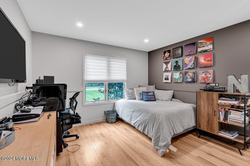 921 Lovett Road Colts Neck, NJ 07722 - Photo 35 of 55 a bedroom with a bed computer on desk and a window