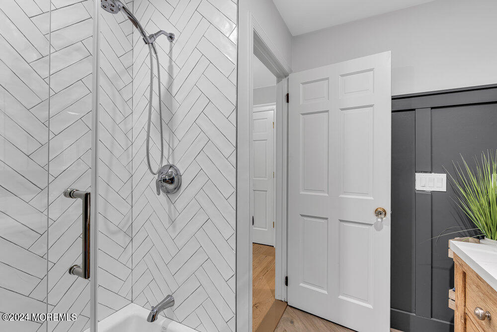 921 Lovett Road Colts Neck, NJ 07722 - Photo 37 of 55 a bathroom with a shower and a tub