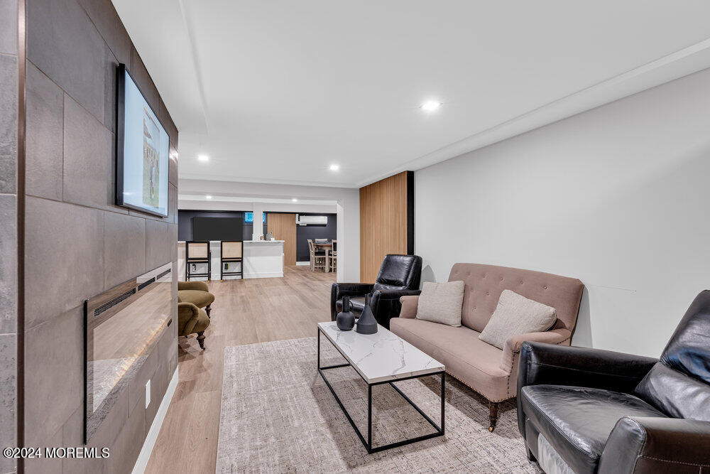 921 Lovett Road Colts Neck, NJ 07722 - Photo 39 of 55 a living room with furniture and a couch