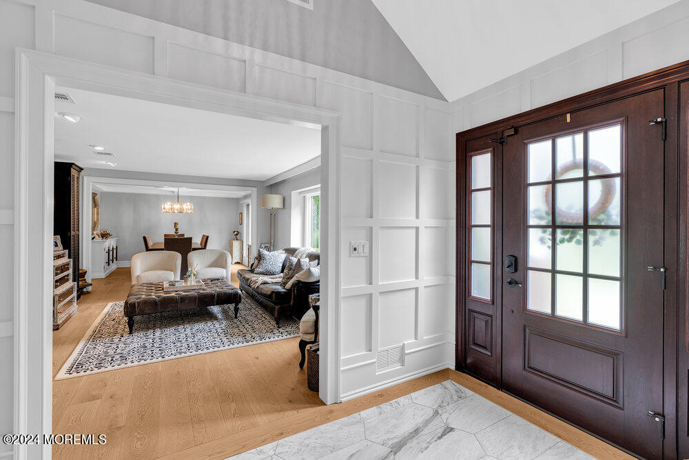 921 Lovett Road Colts Neck, NJ 07722 - Photo 4 of 55 a living room with furniture and a large window