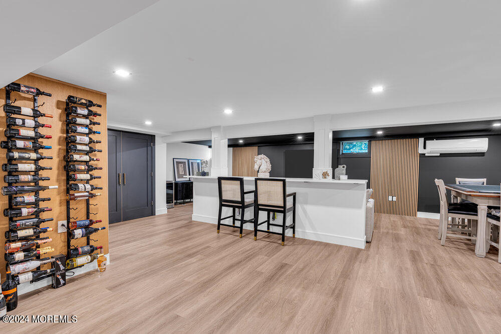 921 Lovett Road Colts Neck, NJ 07722 - Photo 43 of 55 a living room with furniture and a wooden floor