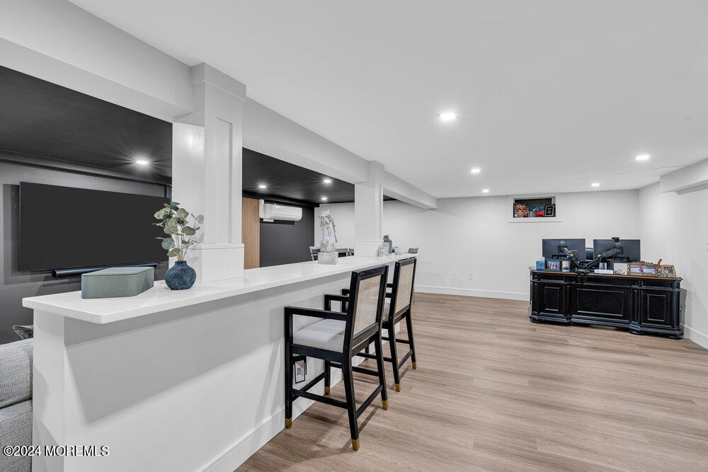 921 Lovett Road Colts Neck, NJ 07722 - Photo 44 of 55 a kitchen with a table and chairs in it
