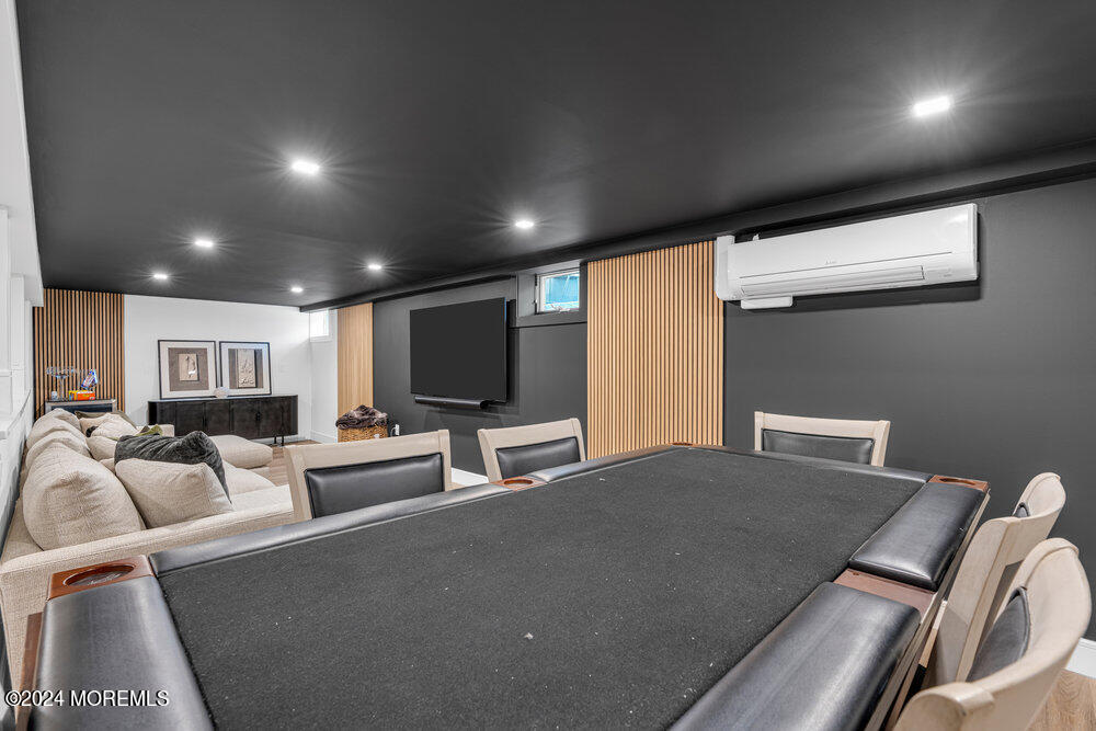 921 Lovett Road Colts Neck, NJ 07722 - Photo 45 of 55 a living room with furniture and a flat screen tv