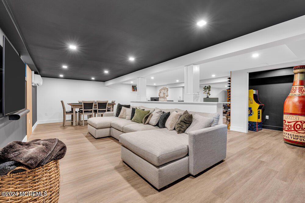 921 Lovett Road Colts Neck, NJ 07722 - Photo 47 of 55 a living room with furniture and a flat screen tv