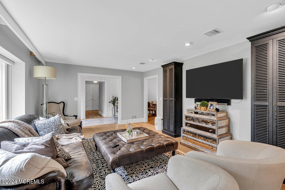 921 Lovett Road Colts Neck, NJ 07722 - Photo 5 of 55 a living room with furniture and a flat screen tv