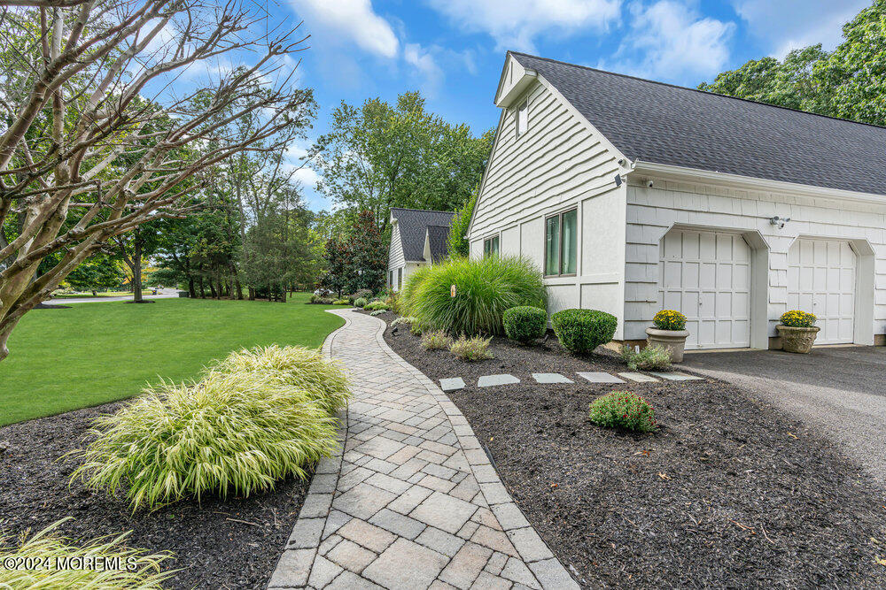 921 Lovett Road Colts Neck, NJ 07722 - Photo 52 of 55 a front view of a house with garden