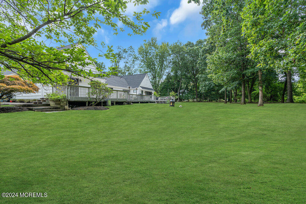 921 Lovett Road Colts Neck, NJ 07722 - Photo 53 of 55 a view of a trees in front of a house