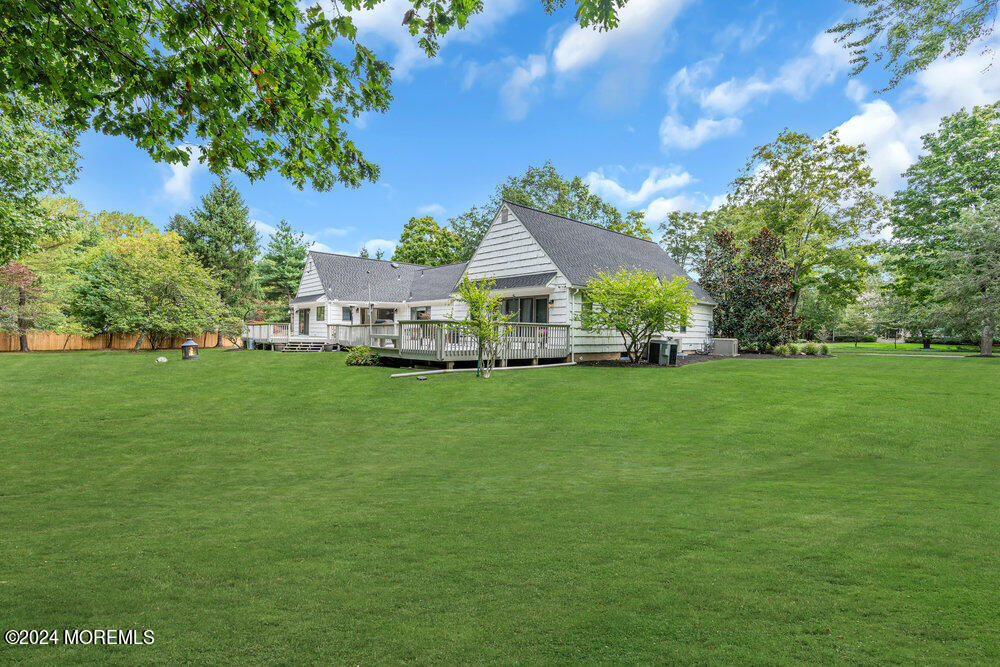 921 Lovett Road Colts Neck, NJ 07722 - Photo 55 of 55 a view of house with garden space and trees