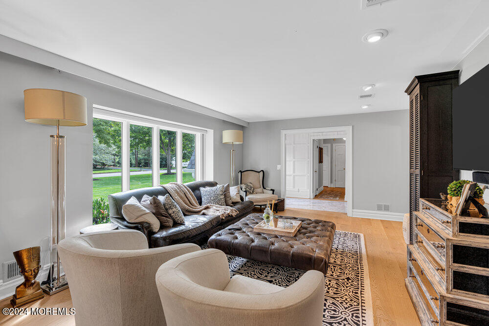 921 Lovett Road Colts Neck, NJ 07722 - Photo 7 of 55 a living room with furniture and a flat screen tv