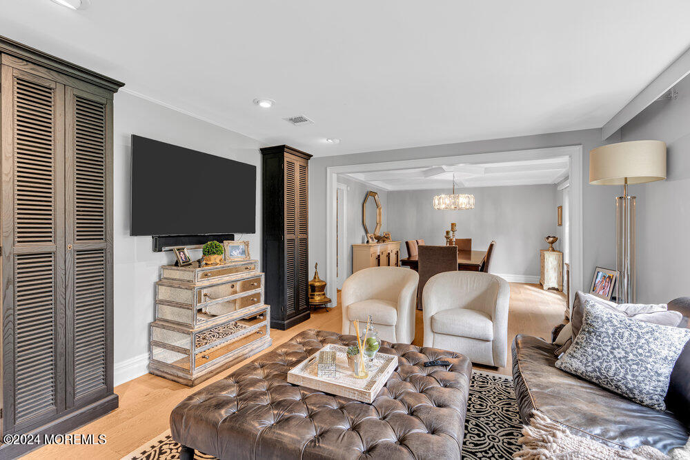 921 Lovett Road Colts Neck, NJ 07722 - Photo 8 of 55 a bedroom with furniture and a flat screen tv