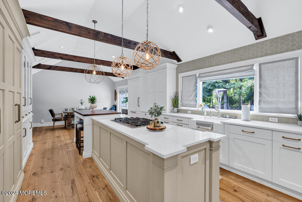921 Lovett Road Colts Neck, NJ 07722 - Photo 10 of 55 a kitchen with a sink a stove and cabinets