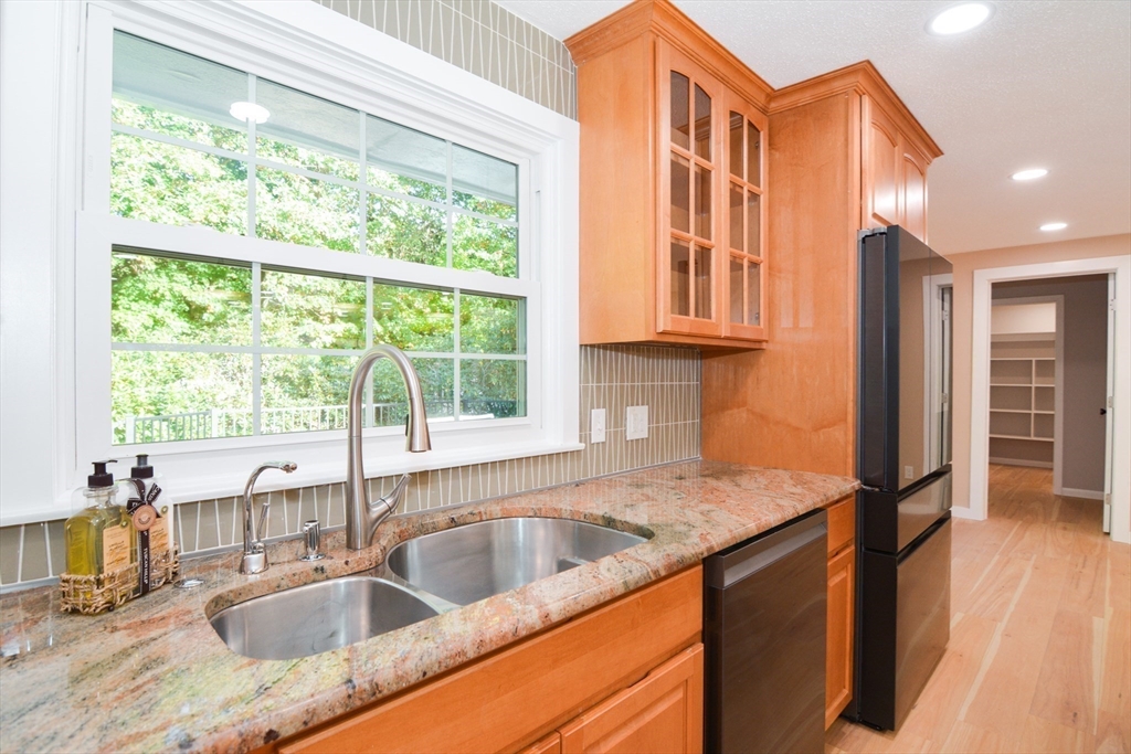 157 Captain Road Longmeadow, MA 01106 - Photo 13 of 41 a kitchen view with granite countertop a sink and a window
