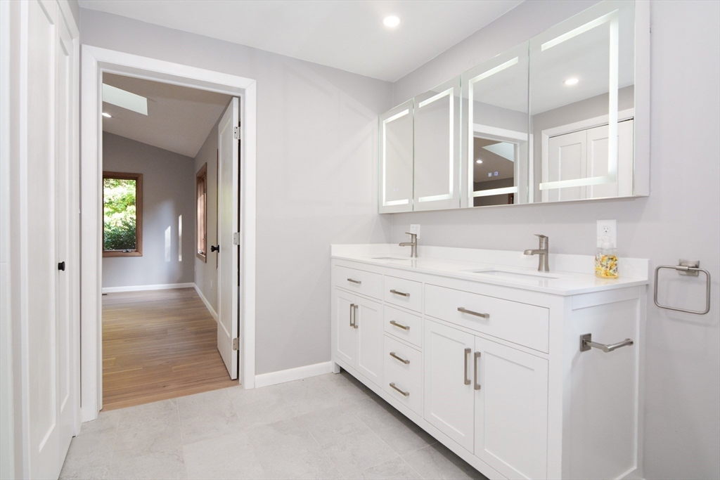 157 Captain Road Longmeadow, MA 01106 - Photo 21 of 41 a bathroom with a sink double vanity and a mirror