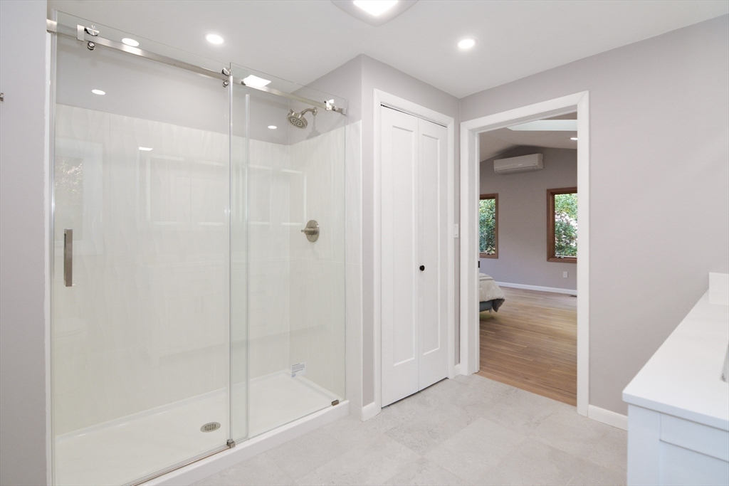 157 Captain Road Longmeadow, MA 01106 - Photo 22 of 41 a bathroom with a shower and a glass door