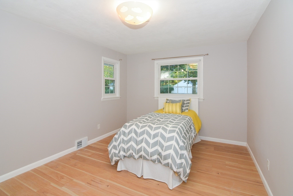 157 Captain Road Longmeadow, MA 01106 - Photo 25 of 41 a bedroom with a bed and a window