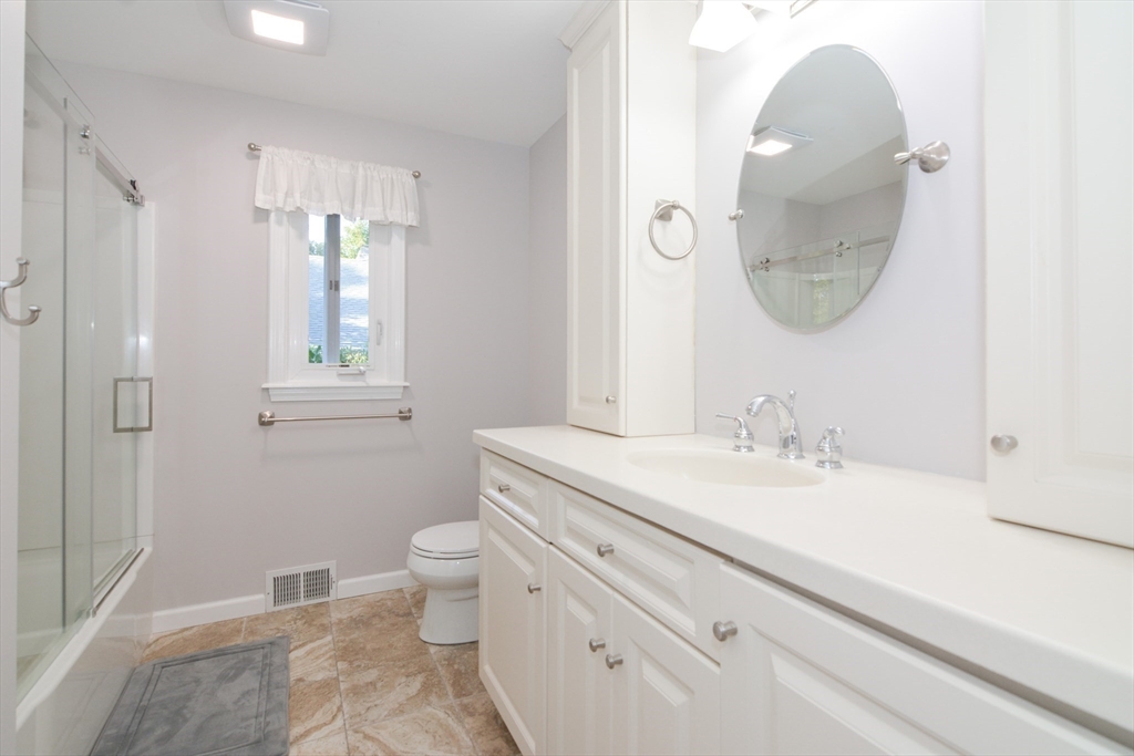 157 Captain Road Longmeadow, MA 01106 - Photo 29 of 41 a bathroom with a sink a toilet and a mirror