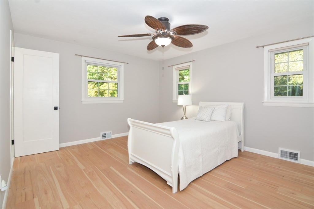 157 Captain Road Longmeadow, MA 01106 - Photo 30 of 41 a white bed sitting in a bedroom next to a window