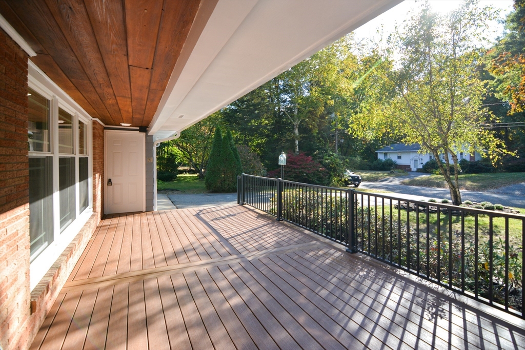 157 Captain Road Longmeadow, MA 01106 - Photo 3 of 41 a view of balcony with wooden floor and fence