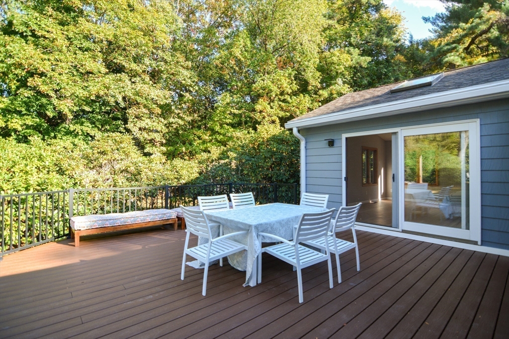 157 Captain Road Longmeadow, MA 01106 - Photo 37 of 41 a view of a patio with table and chairs and wooden floor