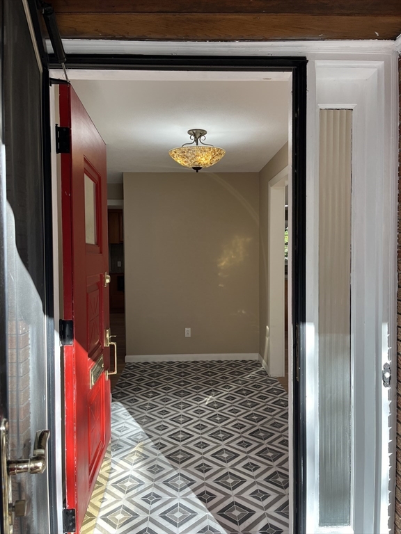 157 Captain Road Longmeadow, MA 01106 - Photo 4 of 41 a view of a hallway with wooden floor and staircase